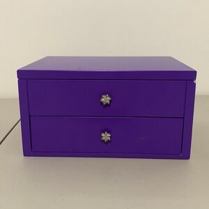 Purple jewelry box with flower knobs